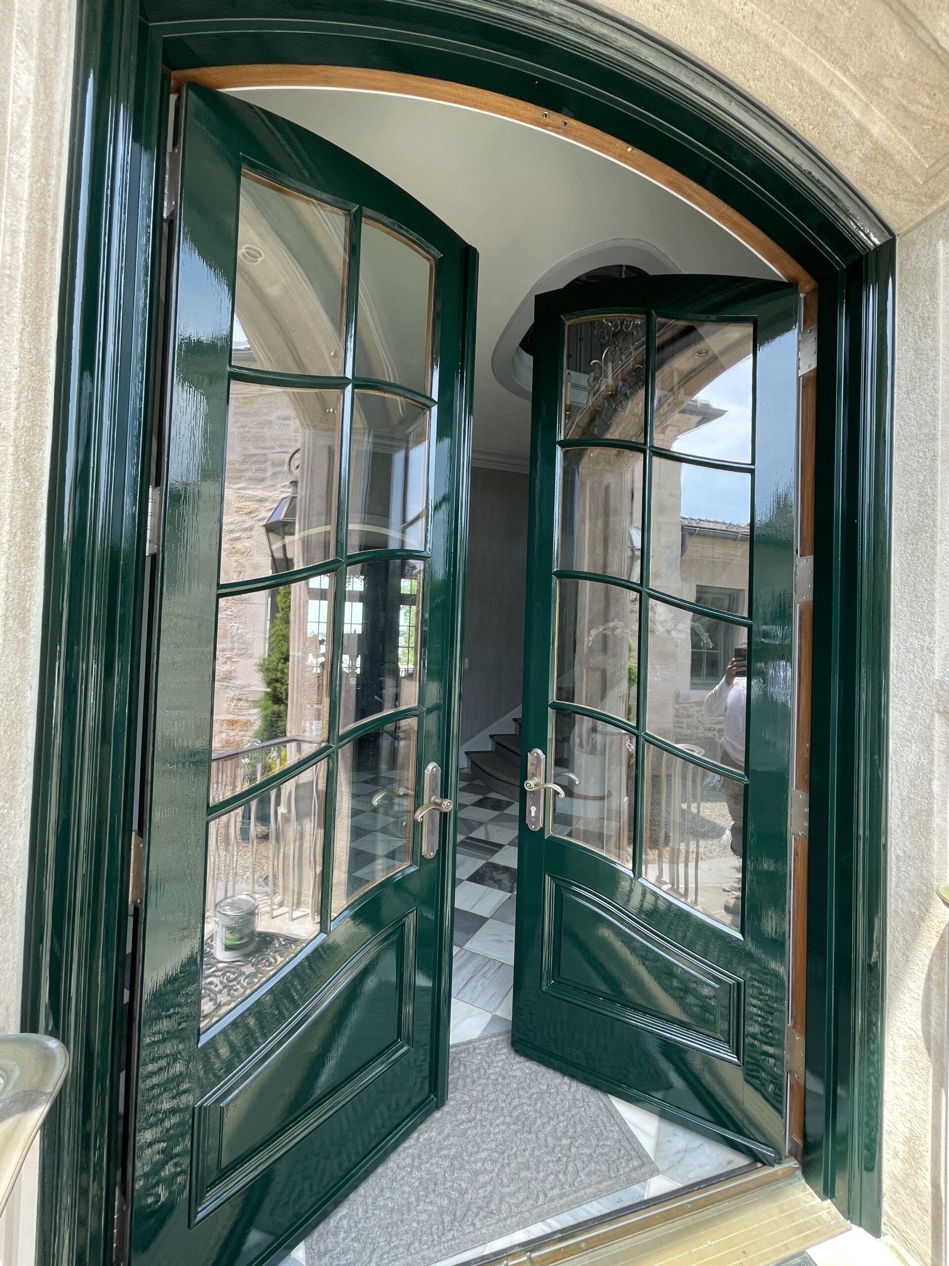 Finished high-gloss green front entry door, completed by L&J Painting Group