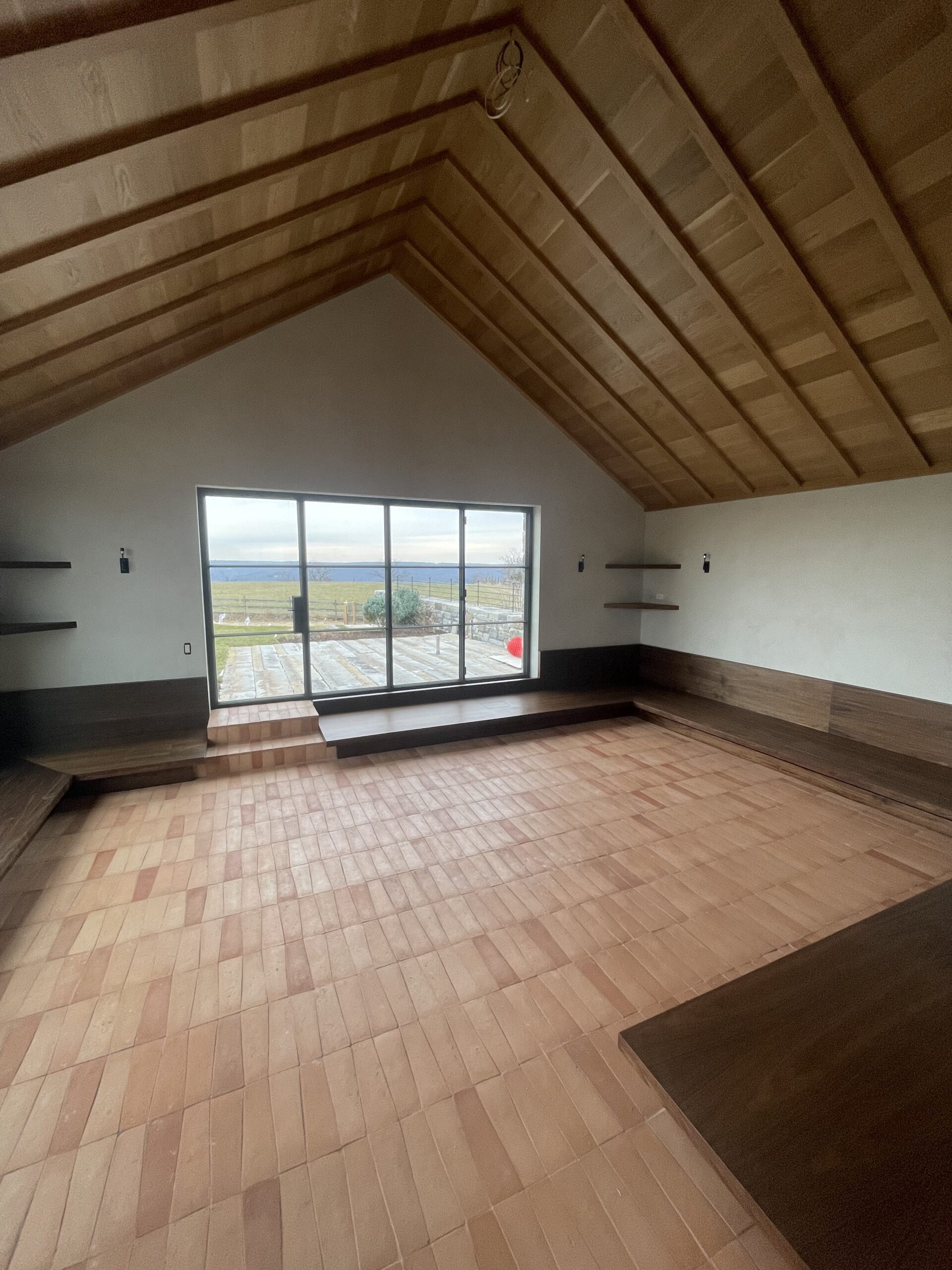 Cathedral-ceilinged room with a full water view, finished by L&J Painting Group